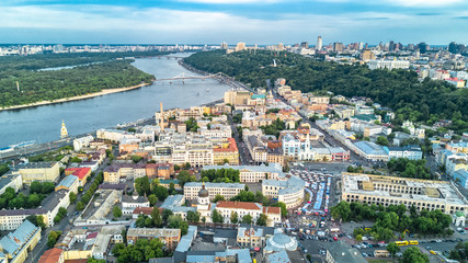 Aerial top view of Kyiv cityscape, Dnieper river and Podol historical district skyline from above, city of Kiev, Ukraine
