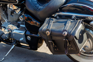 Leather biker bag on a motorcycle close-up. Concept travel on a motorcycle