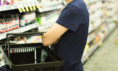 Woman Customer Shopping at Grocery Pharmacy. Supermarket Shopper Doing Groceries. Female Holding...