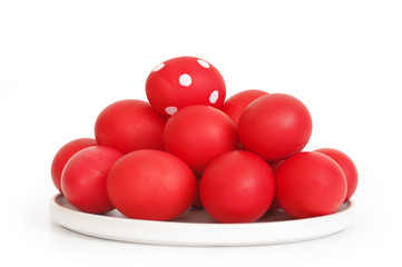 Red Easter eggs in plate