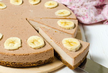 Delicious banana cake on table top view. Banana cheesecake.