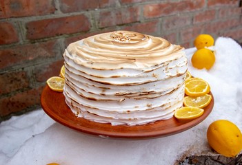 cake with lemons and baked swiss meringue