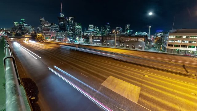 Wide City Night Timelapse with Glowing Street Lights and Freeway Car Streaks