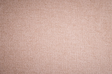 Textured background surface of textile upholstery furniture close-up. burlap beige color fabric structure