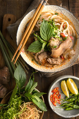 Bun Bo Hue, Bun Bo, Vietnamese beef noodle soup spicy. A bowl of beef & rice vermicelli soup,...