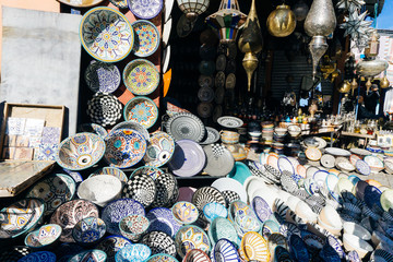 Moroccan oriental ceramics (bowls, plates, dishes) on the market in the medina of Marrakesh, Morocco