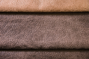 Colorful and bright fabric samples of furniture and clothing upholstery. Close-up of a palette of...