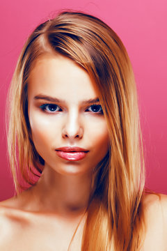 young pretty blonde real woman with hairstyle close up and makeu