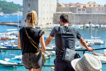 A guy and a girl look at the Marina in Dubrovnik,Croatia. 