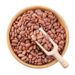 pinto beans in a wooden bowl isolated on a white background