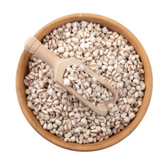 Millet rice in a wooden bowl isolated on white background