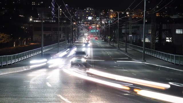 Busy City Street Car Light Streak Trails with Far Vanishing Point of Focus