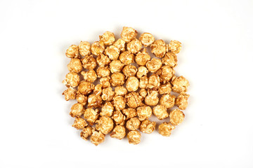Pile of caramel popcorn on white background.