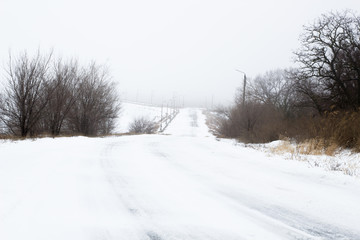 Winter weather , snow road , foggy snow