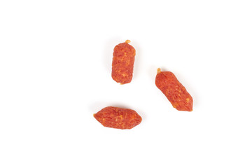 Small smoked sausages isolated on a white background.