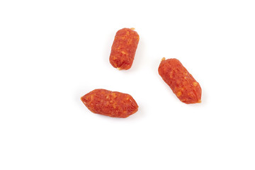 Small smoked sausages isolated on a white background.