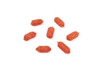 Small smoked sausages isolated on a white background.