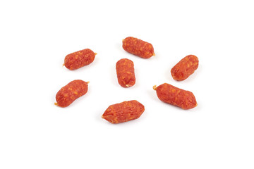 Small smoked sausages isolated on a white background.