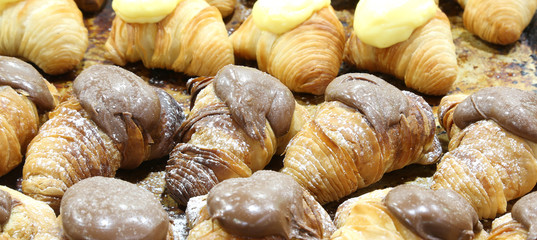 croissants filled with cream and chocolate in a pastry