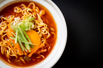 korean spicy instant noodles with egg, vegetable and kimchi
