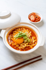 korean spicy instant noodles with egg, vegetable and kimchi