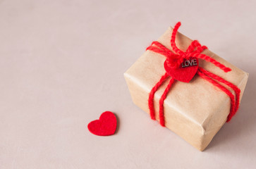 Valentine gift box with ribbon and heart decor. Close up. Selective focus.