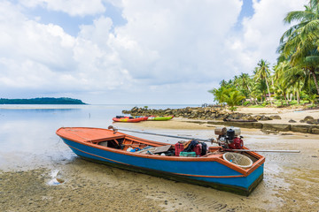 Naklejka na ściany i meble Wooden fishery boat on sea beach
