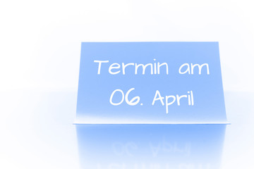 Termin am 6. April - blauer Zettel mit Notiz