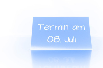 Termin am 8. Juli - blauer Zettel mit Notiz