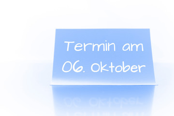 Termin am 6. Oktober - blauer Zettel mit Notiz