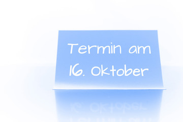 Termin am 16. Oktober - blauer Zettel mit Notiz