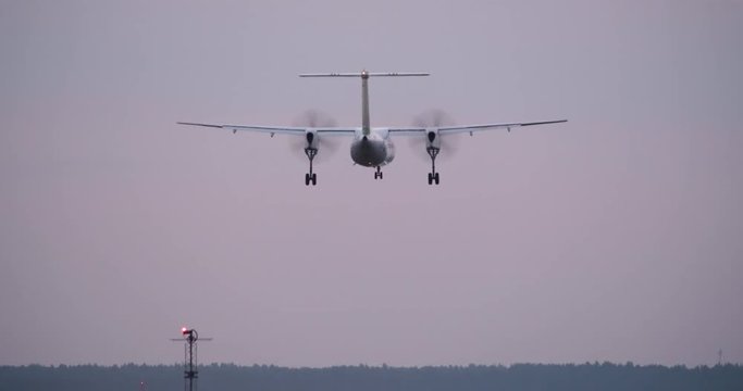 4K - Turboprop aircraft landing on runway