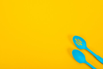 Design concept of kitchen utensils isolated on yellow background