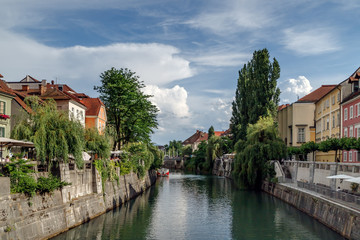 Fototapeta na wymiar Ljubljana, Slovenia. Cityscape view on Ljubljanica river canal in Ljubljana old town. Holidays in Slovenia.