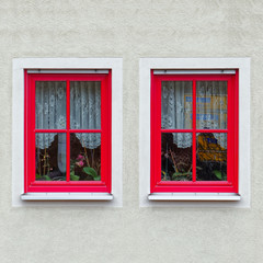 Fototapeta na wymiar Christmas decorated house windows with red frame, Germany