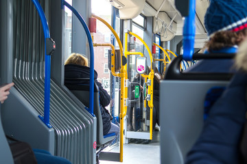 People inside the tram wagon. Selective focus