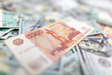 Dollars and Russian rubles on the table as background