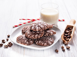 Crackled chocolate cookies on a old wooden table