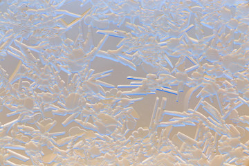 Snow patterns on glass as an abstract background