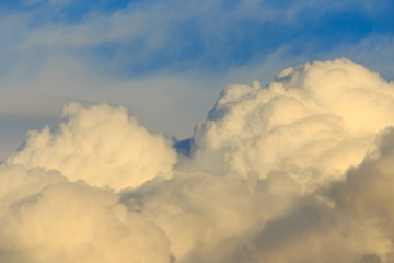 Clouds after rain before sunset as a background
