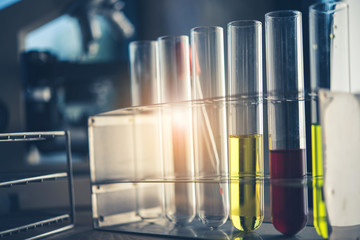 Laboratory glassware containing colorful chemical liquid, lab research and development concept