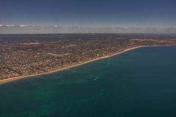 Taking Off  from Adelaides International Airport with a clear blue sky showing spectacular views of the city and its coastline.