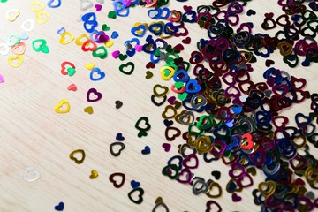 Heart shape decorations scattered on white background