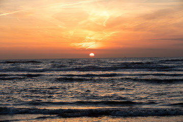 Scenic View Of Sea Against Orange Sky