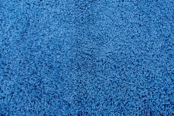 Fototapeta na wymiar Close-up of blue artificial fabric texture