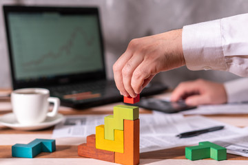 Fototapeta premium Businessman with conundrum at table in office.