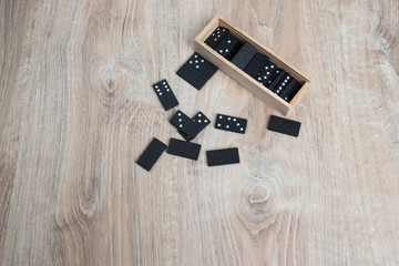 Domino game. Dominoes on a wooden table.