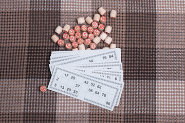 Lotto game. Wooden lotto barrels and card for a game in lotto. Board game lotto or bingo.