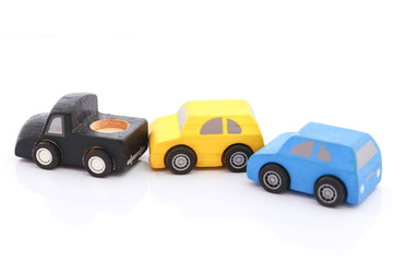 wooden car toy on white background.