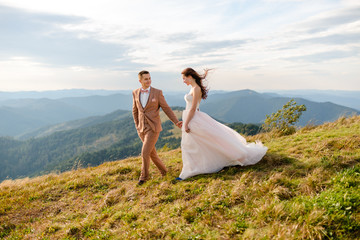 Young love couple celebrating a wedding in the mountains